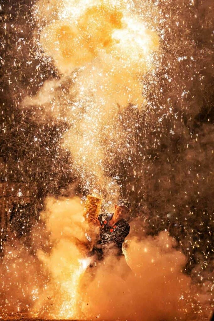 A man holding hand launched fireworks.